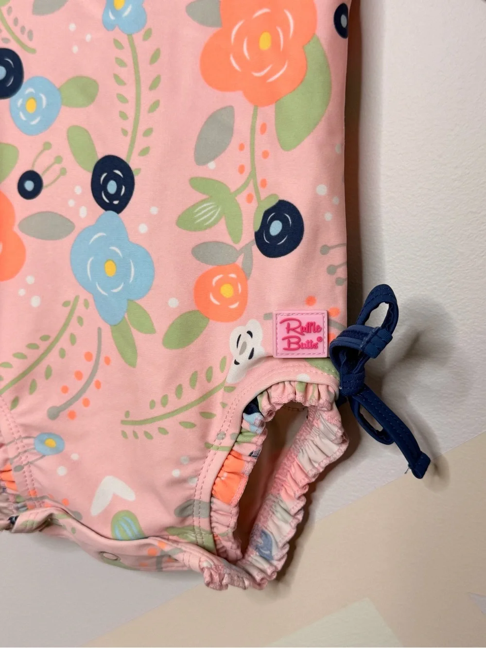 Ruffle Butts Pink Floral Long-Sleeve Swim Bodysuit with Navy Bows